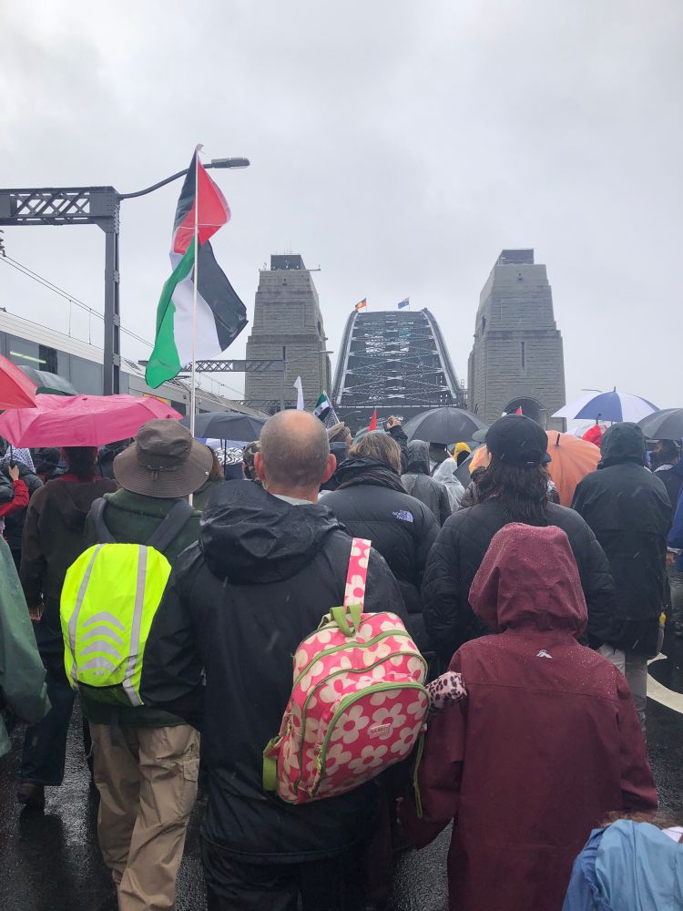 March for humanity marchers walking over the Sydney Harbour Bridge. 