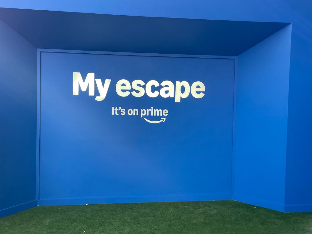 The entrance to the event - My Escape is set against a blue backdrop. 