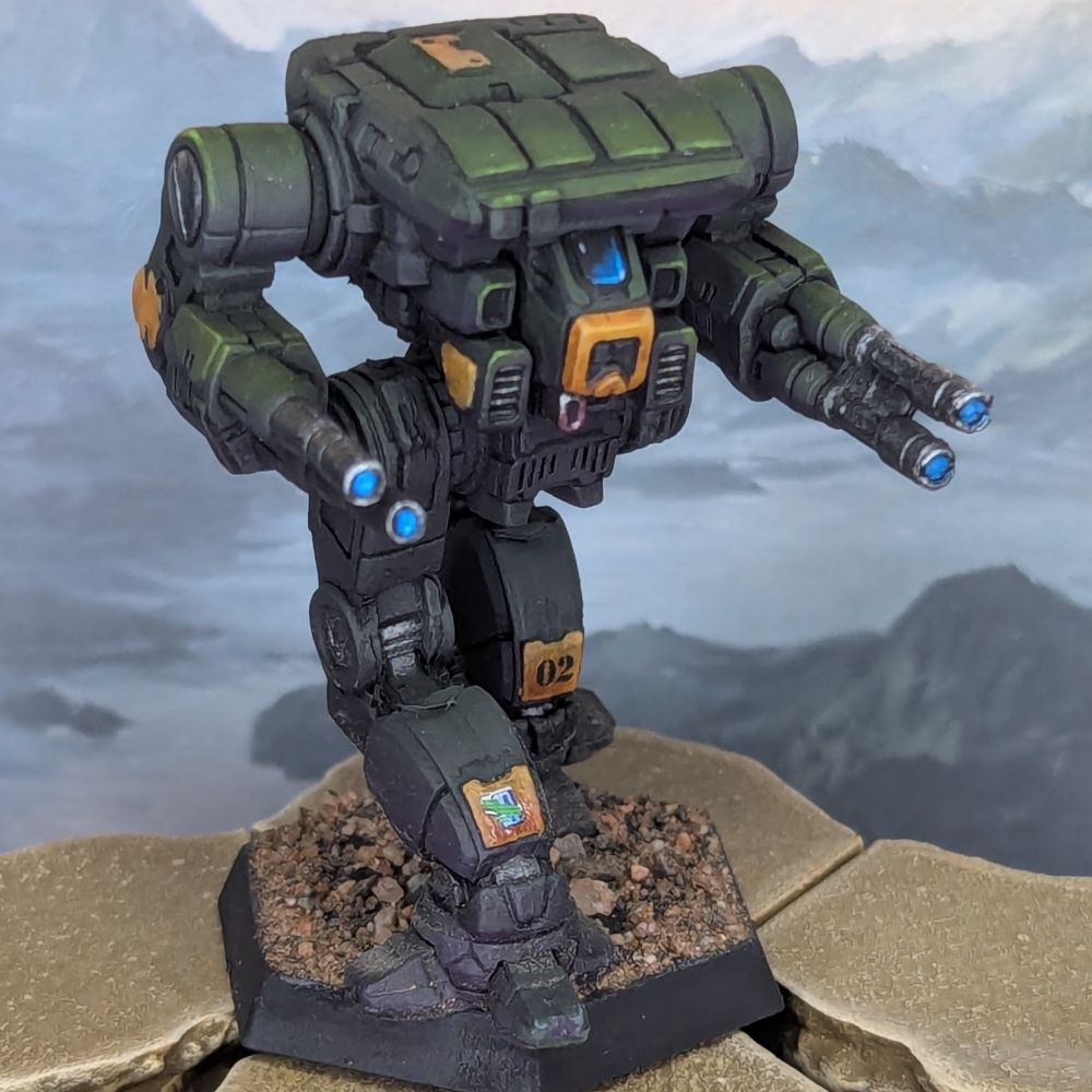 A Battletech miniature of a Warhawk battlemech, painted in green and yellow for the 1st Falcon Sentinels.