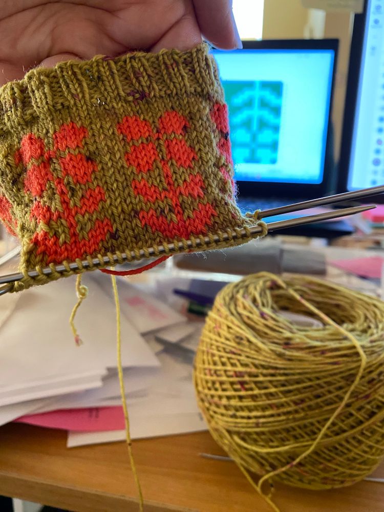 In progress knitting displaying the Fair Isle cuff.