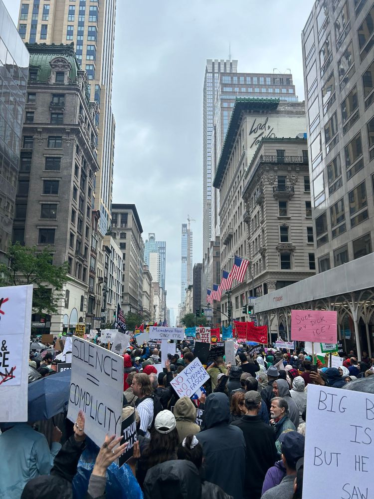 Photo of a massive crowd of protesters marching down 5th avenue in Manhattan