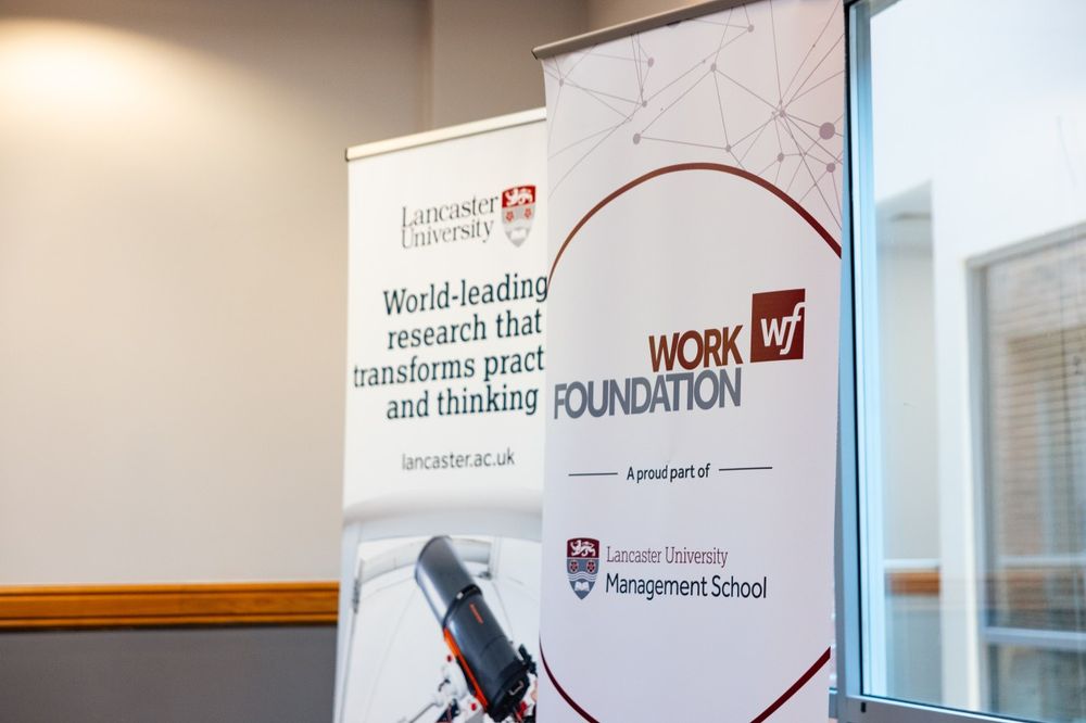 Photo of a Work Foundation and Lancaster University banner