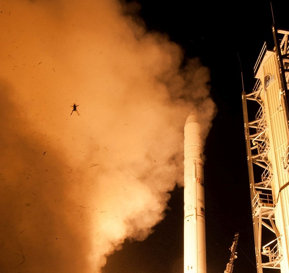 Photo of frog in midair after being thrown from a Nasa moon probe during launch