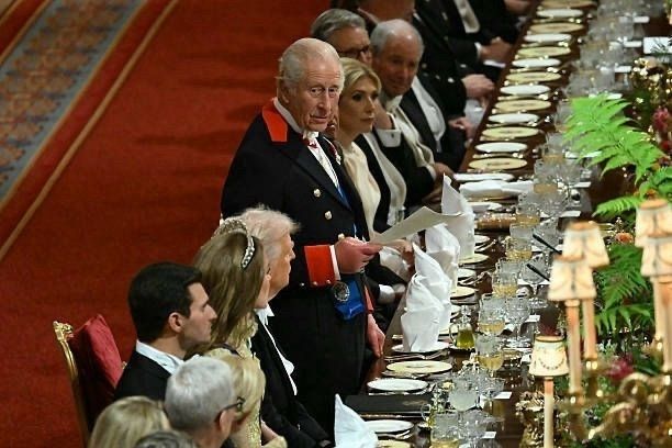 King Charles addressing the banquet that got thrown in as a package deal for the unwanted visit by that asshole Trump .