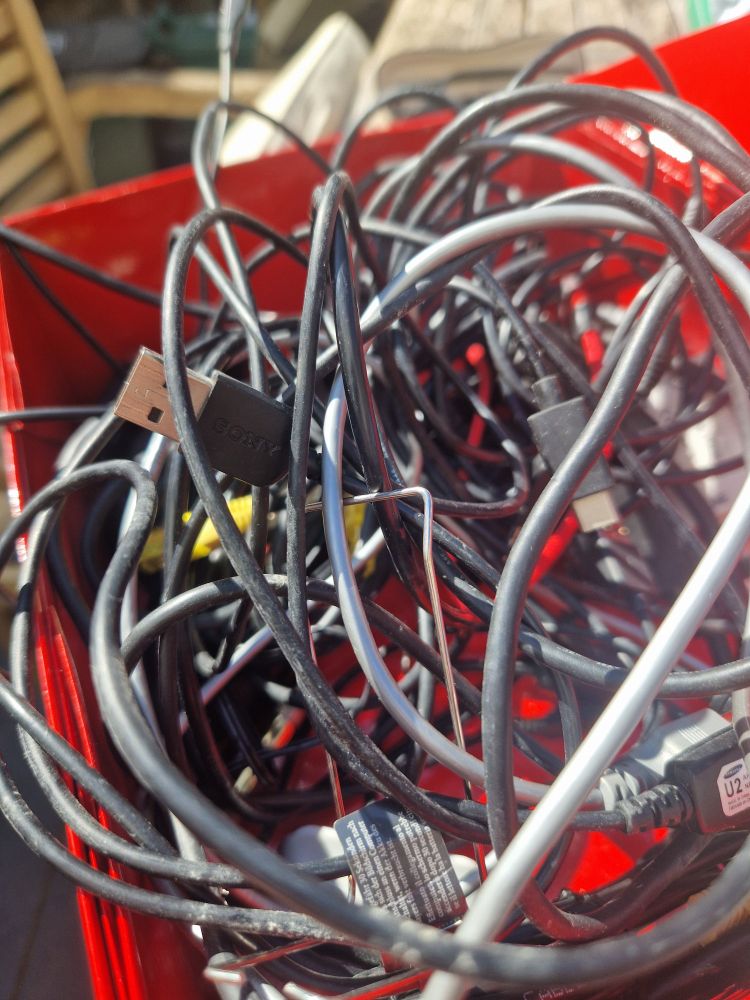 A massive tangle of wires on a garden table