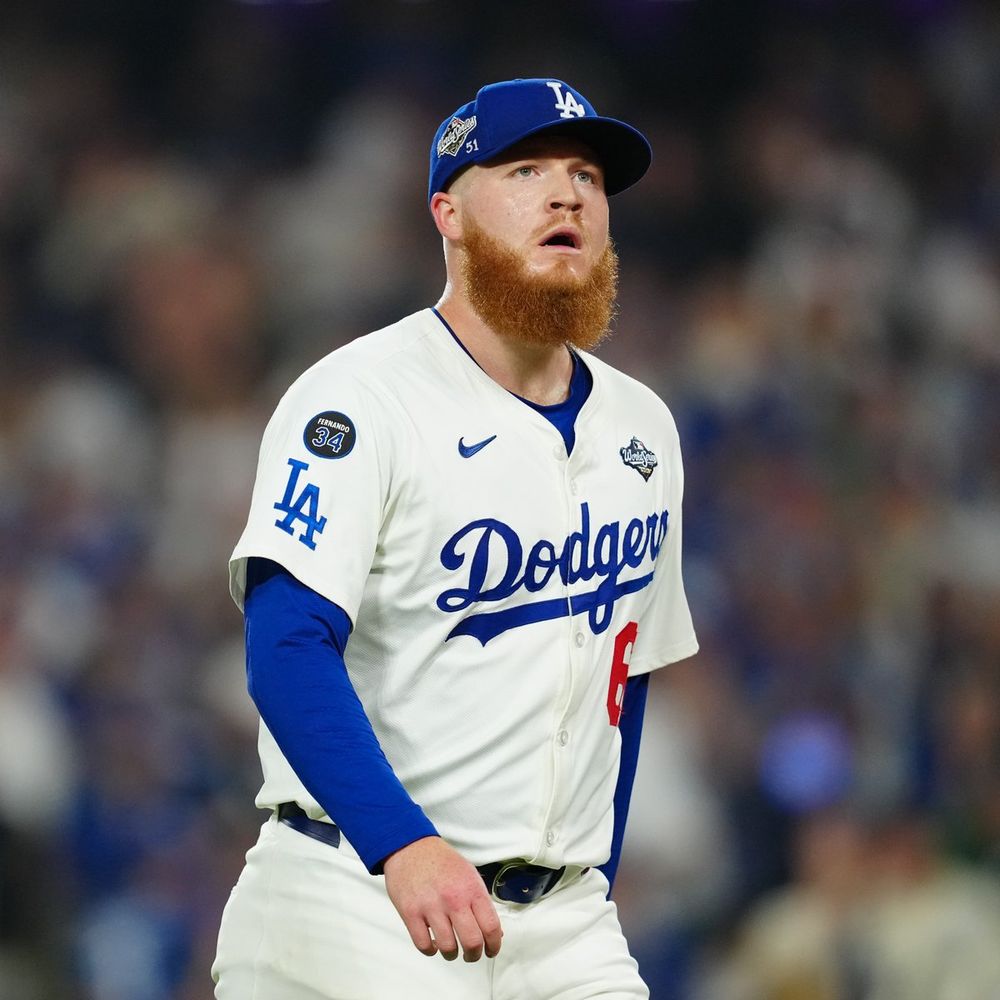 Will Klein walks off the mound during World Series Game 3 wearing a white Los Angeles Dodgers uniform with blue lettering and red numbering.
