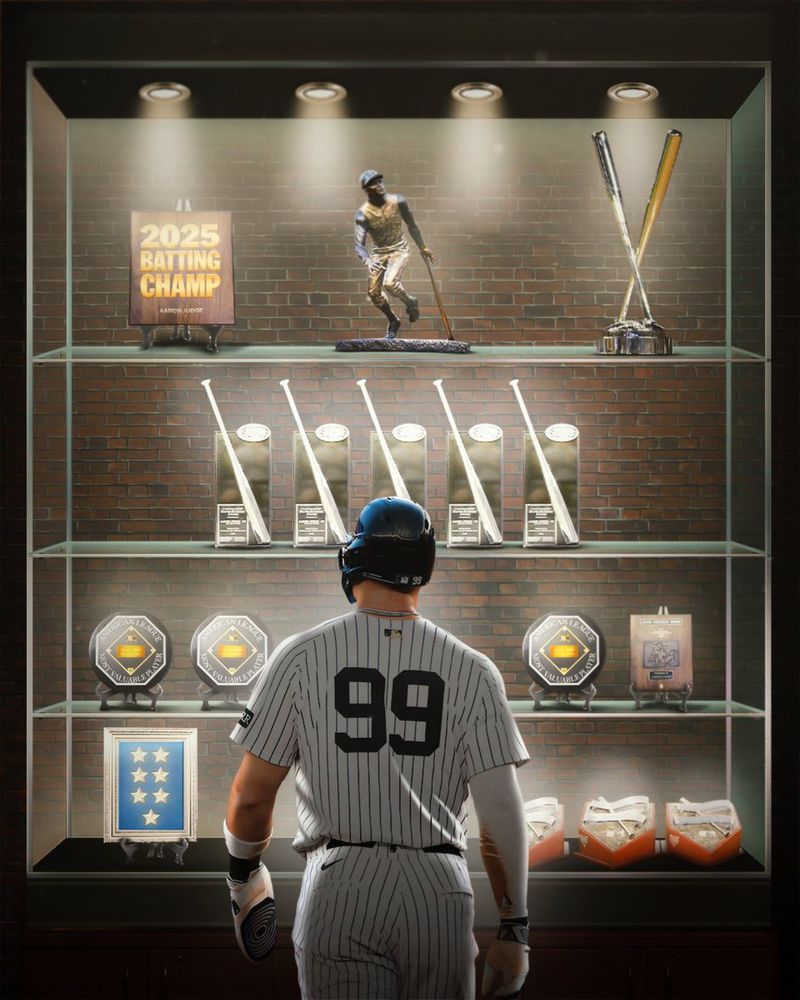Aaron Judge looks at a trophy case holding all of his awards and accomplishments during his MLB career.
2025 Batting Champ, Roberto Clemente Award, Home Run Derby Champion, 5 Silver Slugger Awards, 3 American League MVP Awards, a Rookie of the Year plaque, 7 All-Star selections, and 3 Hank Aaron Awards