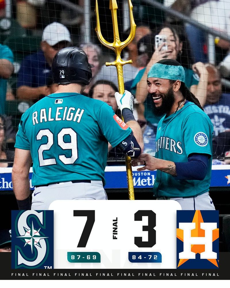 Final Score Graphic 9.21.25
Mariners 7 (87-69), Astros 3 (84-72)
Pictured: J.P. Crawford hands Cal Raleigh the Mariners home run trident as Raleigh approaches the dugout Sunday night. They both wear teal Seattle Mariners uniforms with white lettering.