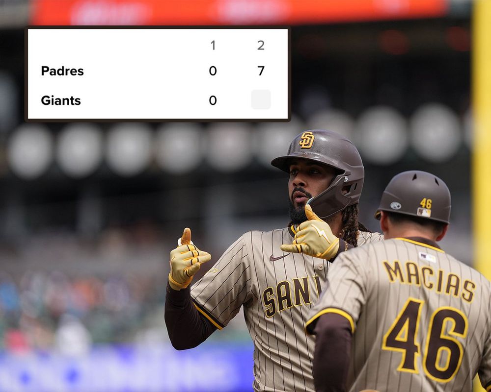 A screenshot of the MLB.com Gameday screen for Padres vs. Giants. The Padres and Giants had a scoreless 1st inning, and the Padres scored 7 in the top of the 2nd.
Pictured: Fernando Tatis Jr. celebrates towards his Padres teammates. He wears a brown Padres jersey and brown helmet.