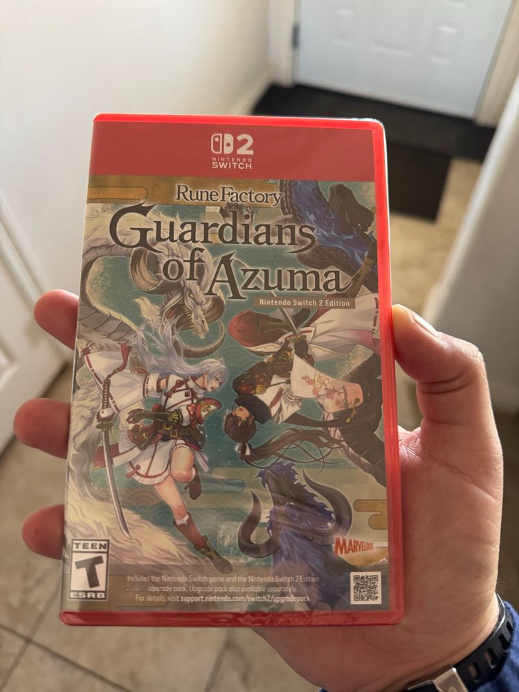 Holding a copy of Rune Factory: Guardians of Azuma Nintendo Switch 2 Edition.