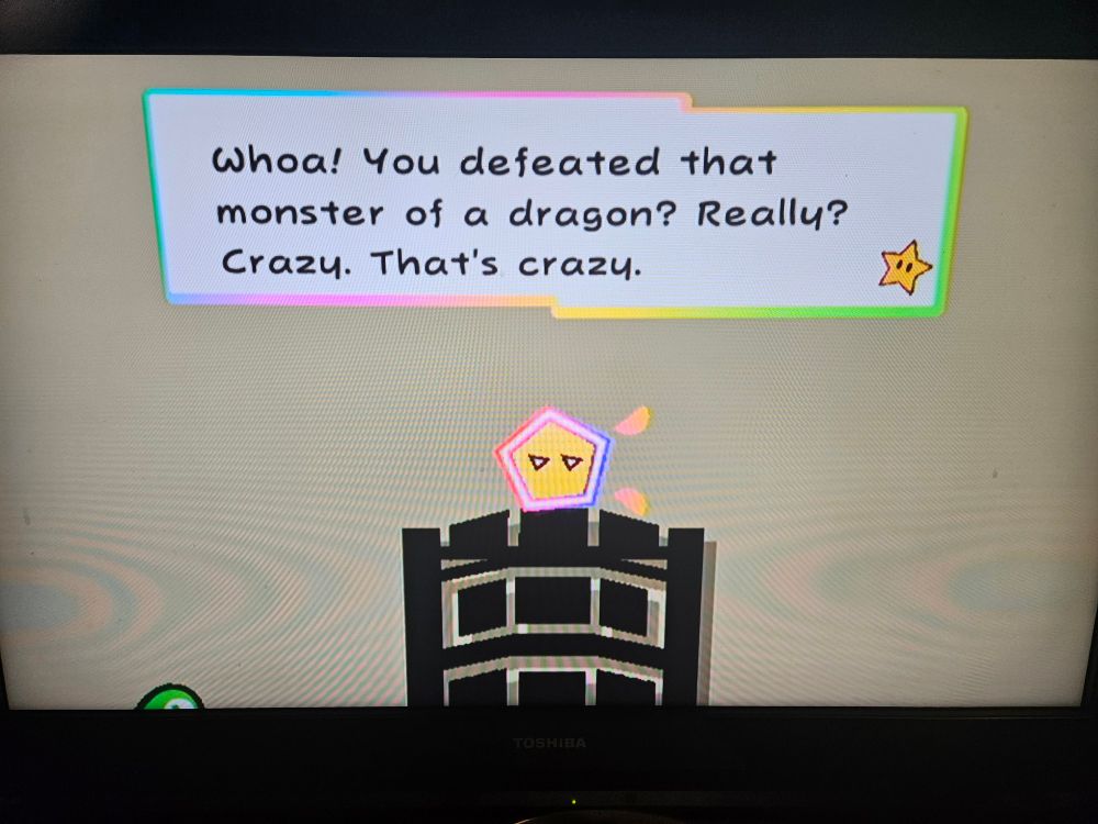 A photo of Super Paper Mario gameplay. A Pixl (fairly-like creature) named Dashell is saying "Whoa! You defeated that monster of a dragon? Really? Crazy. That's crazy."