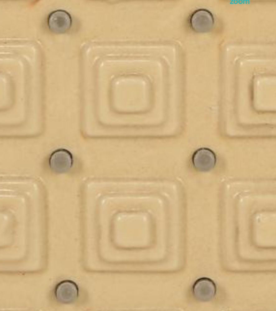 A photograph of a prop from the film “Alien”, it’s a panel from the lighted grid-spaced LED wall inside of “MU-TH-UR”. It’s made of fiberglass in a wood frame and the beige, like an old computer, has yellowed over time.