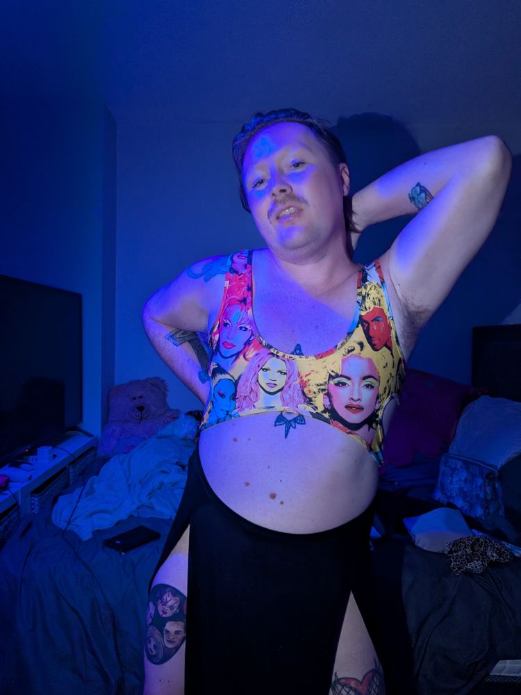 Picture of Tadhg wearing a cut out bodysuit and black skirt