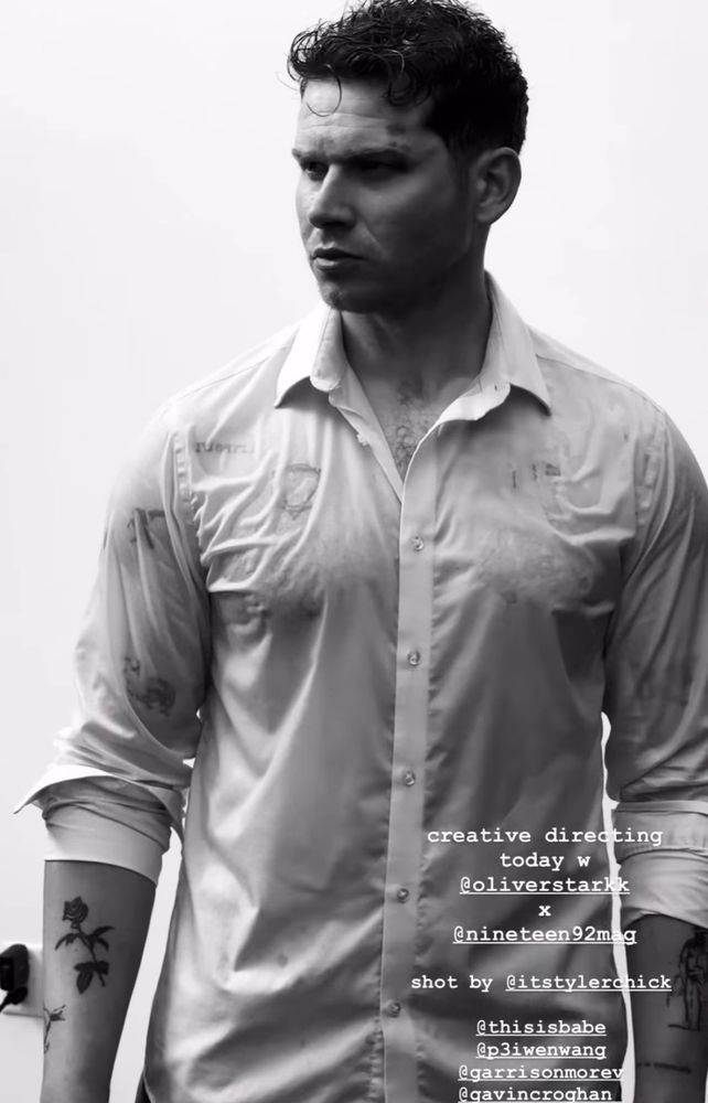 Oliver stark wearing a wet white long sleeve button up