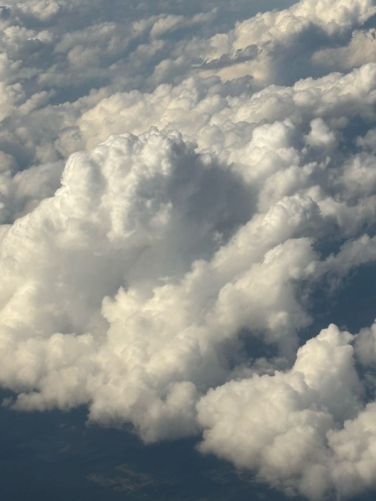 Photo of cumulonimbus clouds taken from airplane at an altitude of 30,000 feet.