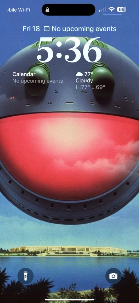 One of my phone wallpapers. It’s a screenshot from the movie Heavy Metal. It depicts a space ship that resembles a happy face floating over the Pentagon.