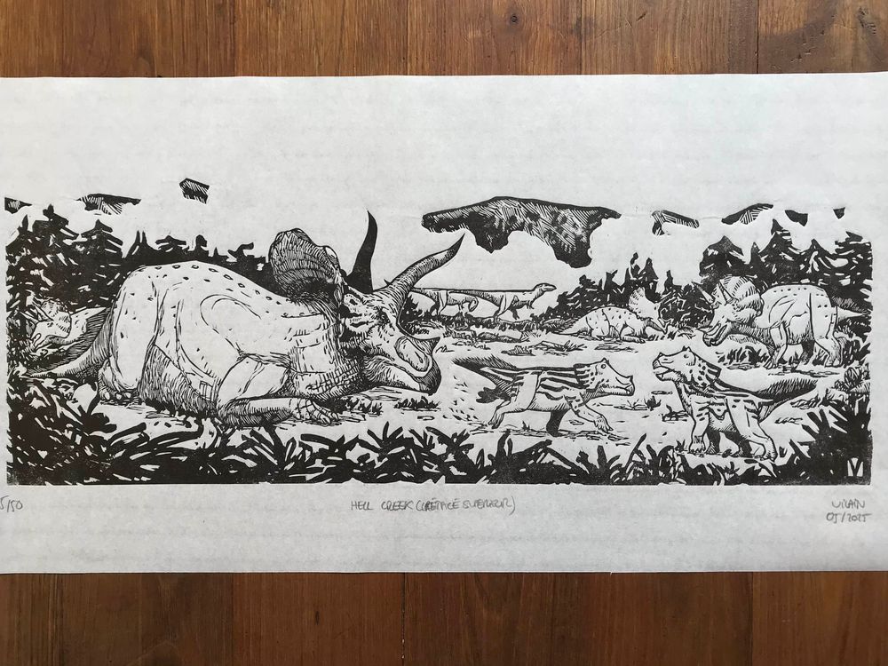Linocut print, black ink on white paper : two young triceratops are playing while a big adult is resting next to them. Other triceratops are grazing in the surroundings.
In the distance, two juvenile tyrannosaurs are cautiously walking away.