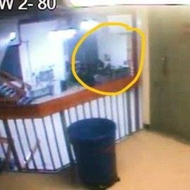 Zoomed in screenshot of the Epstein camera video at 12, showing a clear space that was shadowed in the 11:58 image