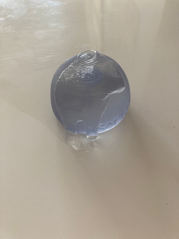 A Speks fidget toy by Gump that has burst open and is spilling its internal fluids