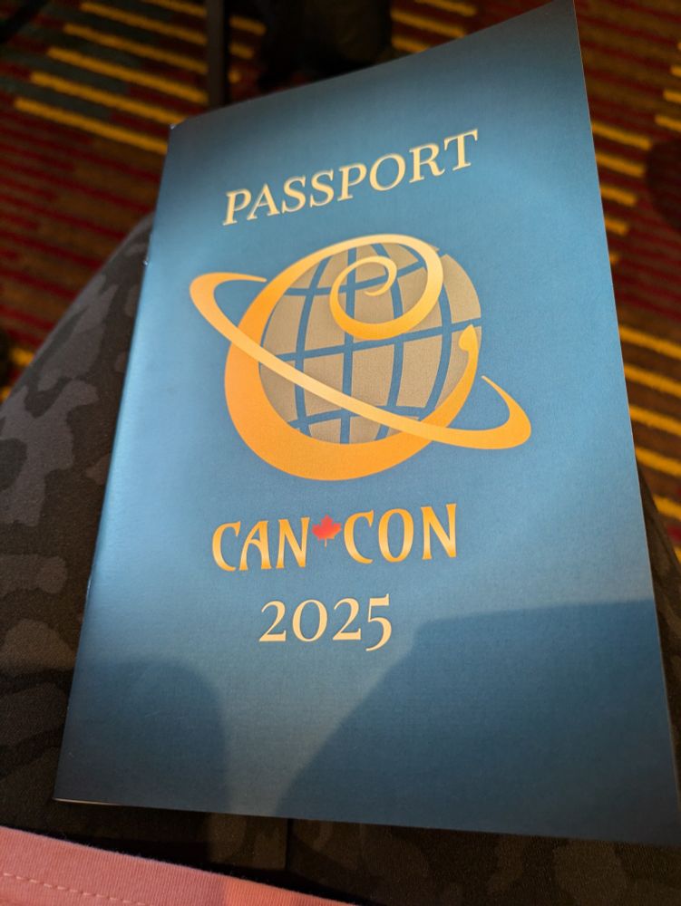 The Can*Con program - text on the front reads "Passport Can*Con 2025"