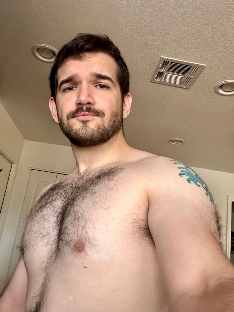Looking down at the camera with my tits out