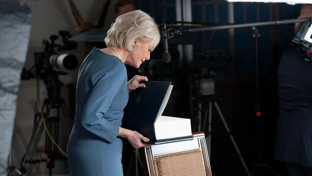 60 Minutes correspondent Lesley Stahl opens a book provided by the White House while preparing to tape an interview with President Donald Trump on Tuesday, Oct. 20, 2020. The page she opened to appears to be blank. The book, according to 60 Minutes, was "filled with executive orders and congressional initiatives, but no comprehensive healthcare plan."