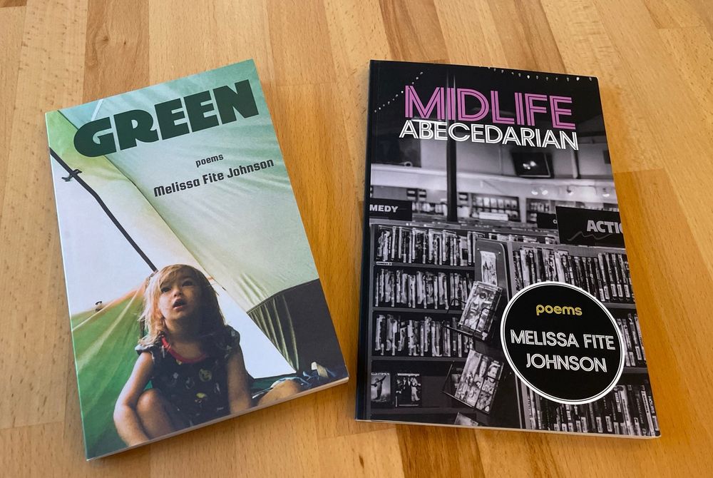 Two poetry collections by Melissa Fite Johnson. 

GREEN has a light green cover ft. a picture of a young blonde child sitting down and looking up in awe and wonder. The setting appears to be in the corner of a light green tent. 

MIDLIFE ABECEDARIAN has a bold, high contrast black and white photo on the cover, ft. shelves chock-full of DVDs for rent.

(I’m sorry if I get this description inaccurately, I think that’s what it is)