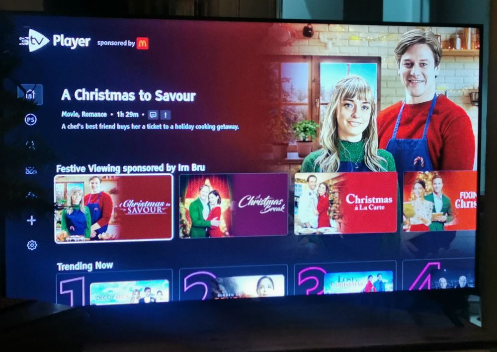 TV screen: STV Player with a curated Christmas section "sponsored by Irn Bru" full of Lifetime type romances
