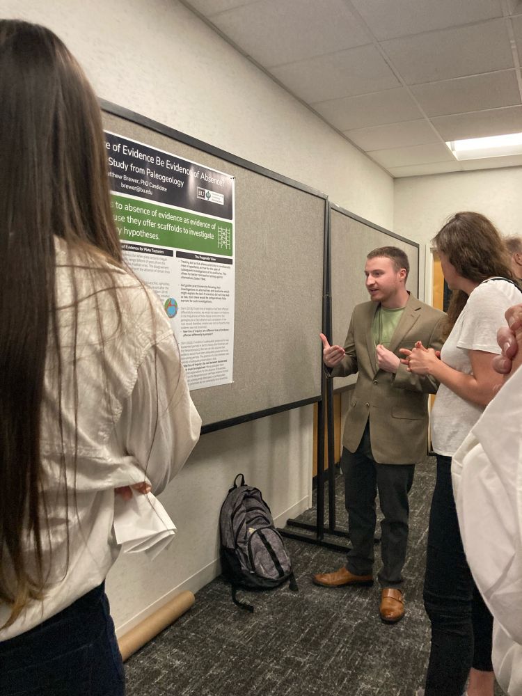 Matt Brewer presenting his poster on the positive roll absence of evidence can play in generating evidence of absence in context of history onset plate tectonics.