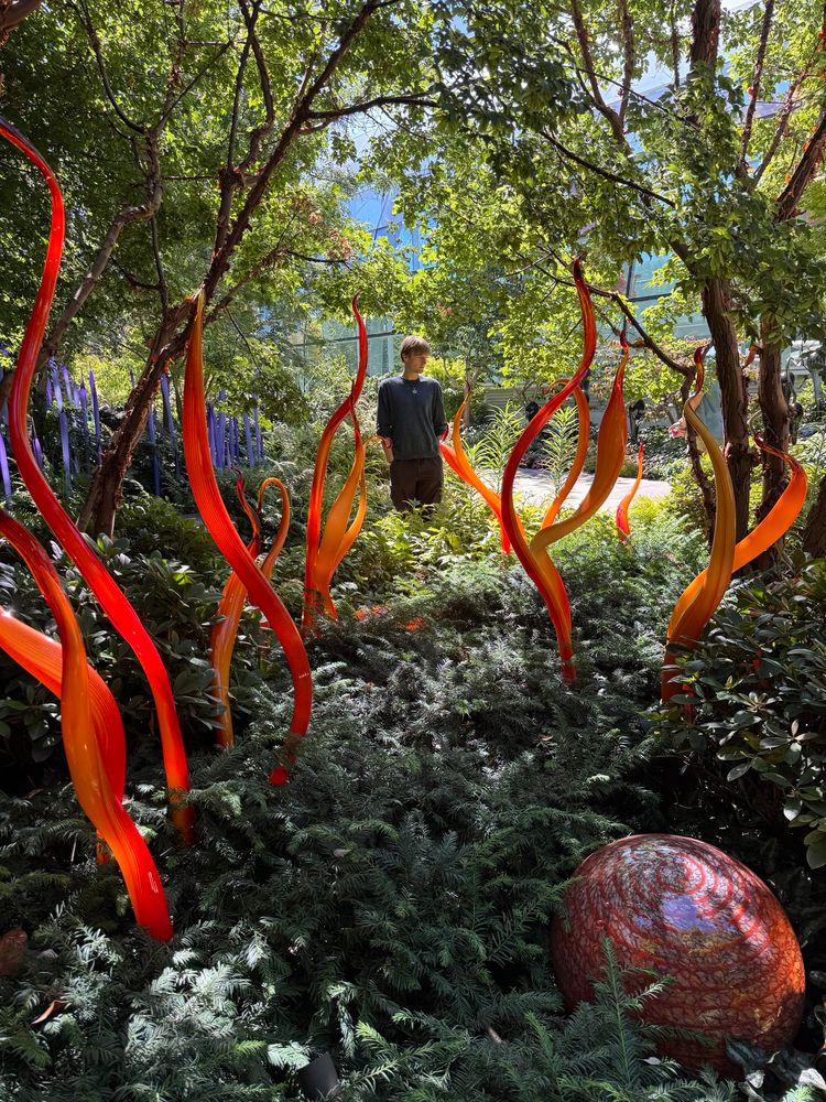 Julian in the glass garden with orange glass flames