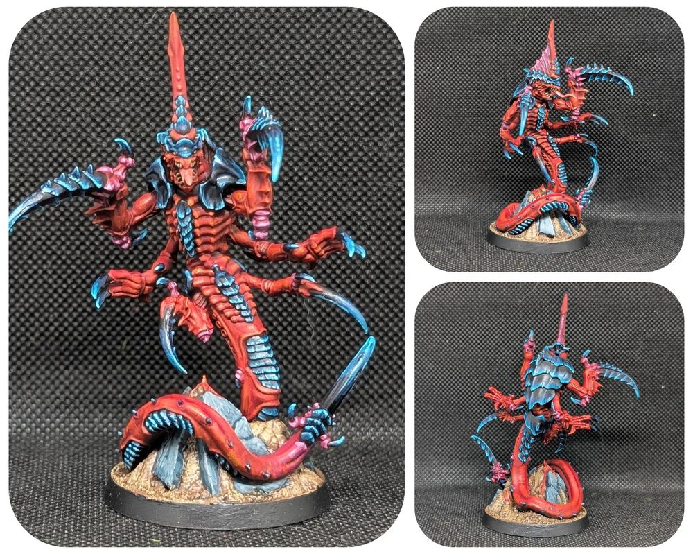 A Tyranid Ravener Prime. He is painted in the red black/blue of hive fleet Behemoth. 