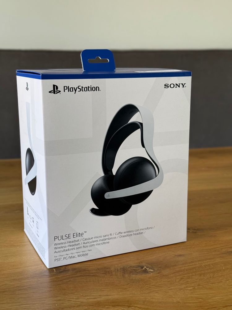Box of Playstation Pulse Elite headphones on a wooden table 