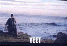 A man in a top hat & suit yeets an elegantly dressed lady off a cliff into the sea