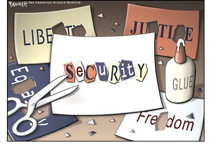 Five sheets of paper, one with "LIBERTY" written on it, another with "JUSTICE", "EQUALITY, and "FREEDOM" and all of them have letters cut out with scissors and the letters are glued to the fifth sheet to spell "SECURITY"