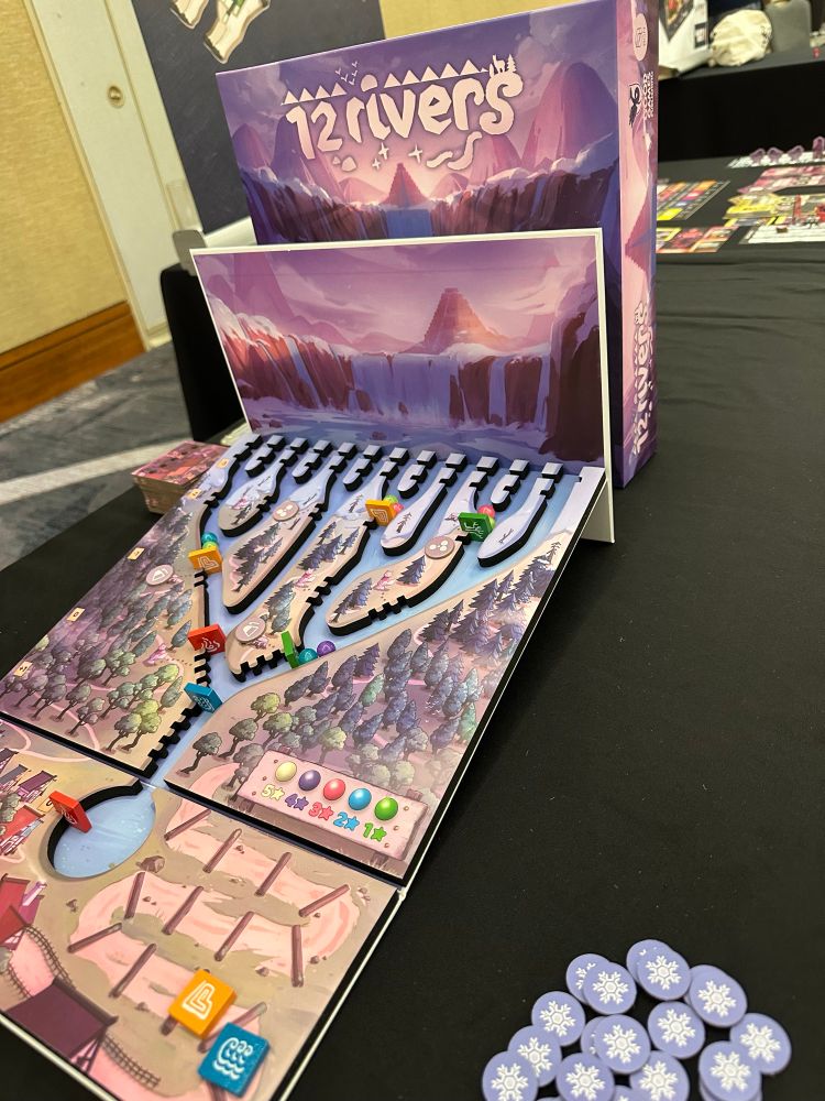 Board featuring a river delta with rolling marbles and various, movable dams. 