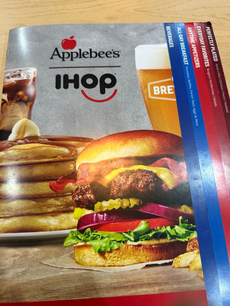 A photograph of the front cover of the Applebee’s IHOP menu