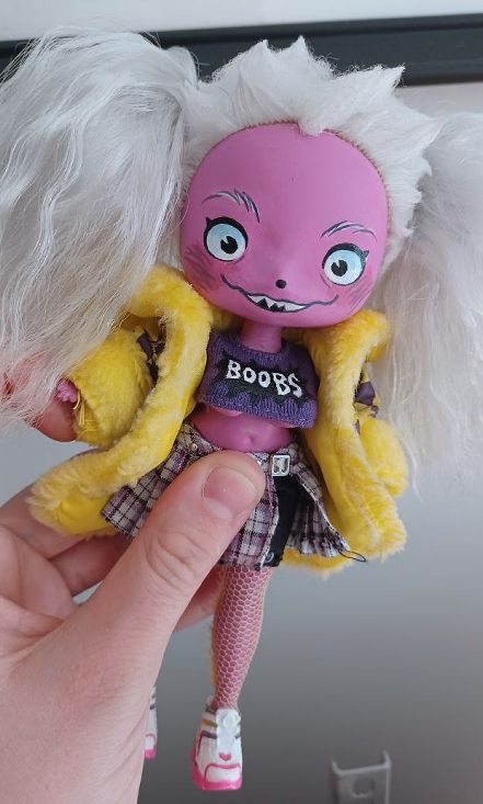 customized art-doll: a pink dog girl, with a sexy outfit and a big smile.