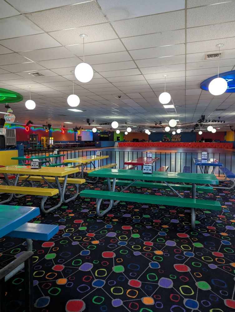 A brightly-lit but empty roller-skate rink.