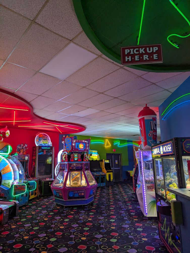 A brightly-lit but empty arcade.