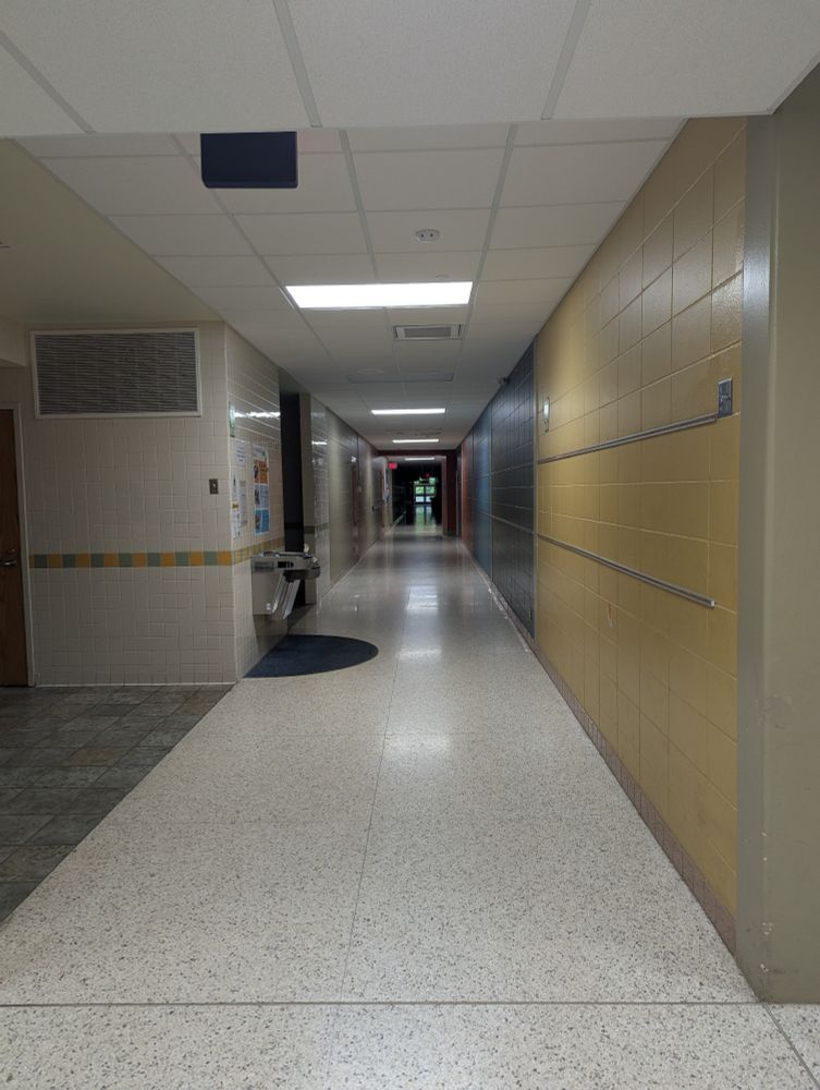 A dark, empty elementary school hallway.