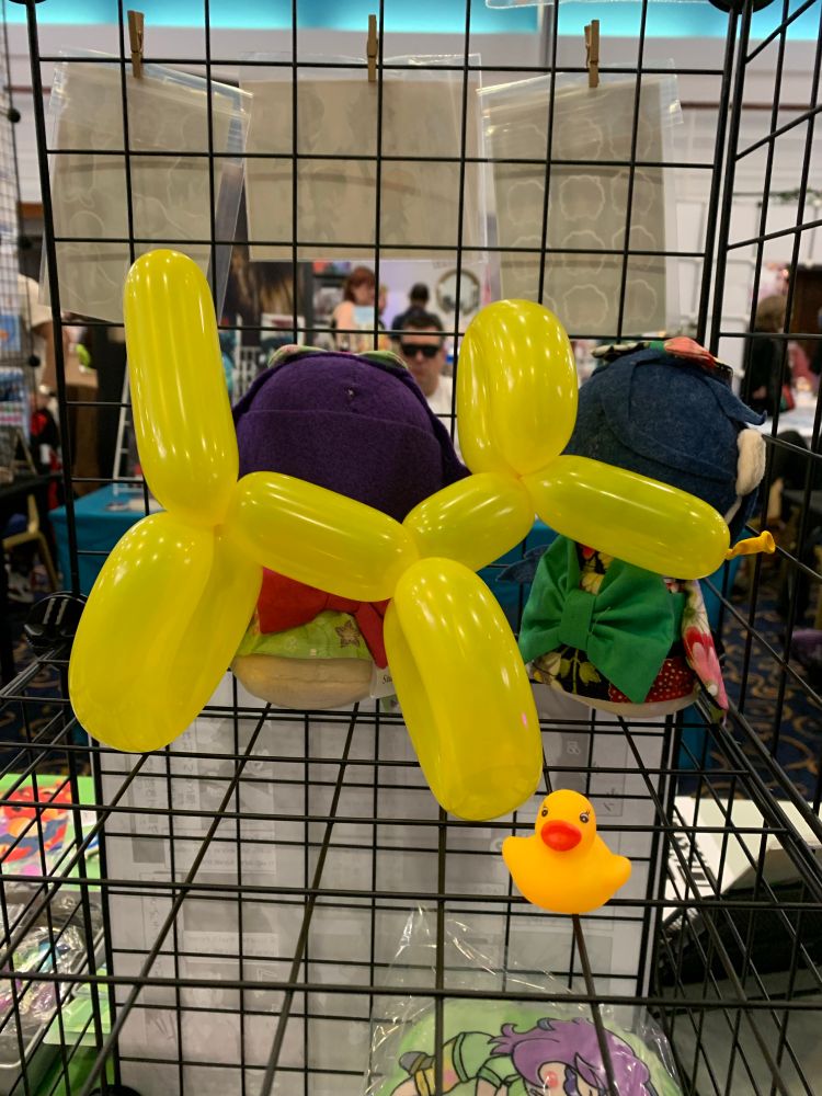 Yellow balloon dog and small rubber duck