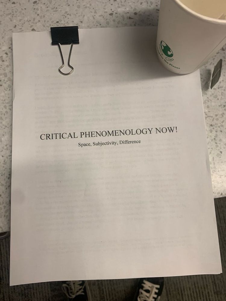 Short stack of printer paper held together with a binder clip. Title reads “critical phenomenology now! Space, subjectivity, difference.” It’s my book draft!