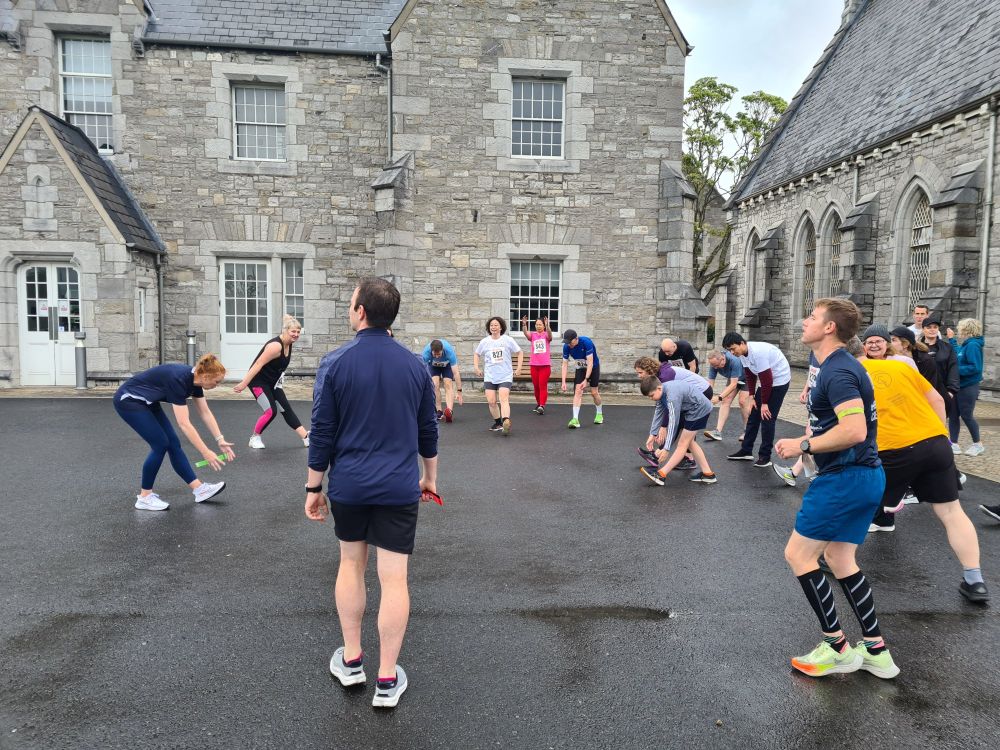 TU Dublin staff warm up for relay race on Grangegorman campus