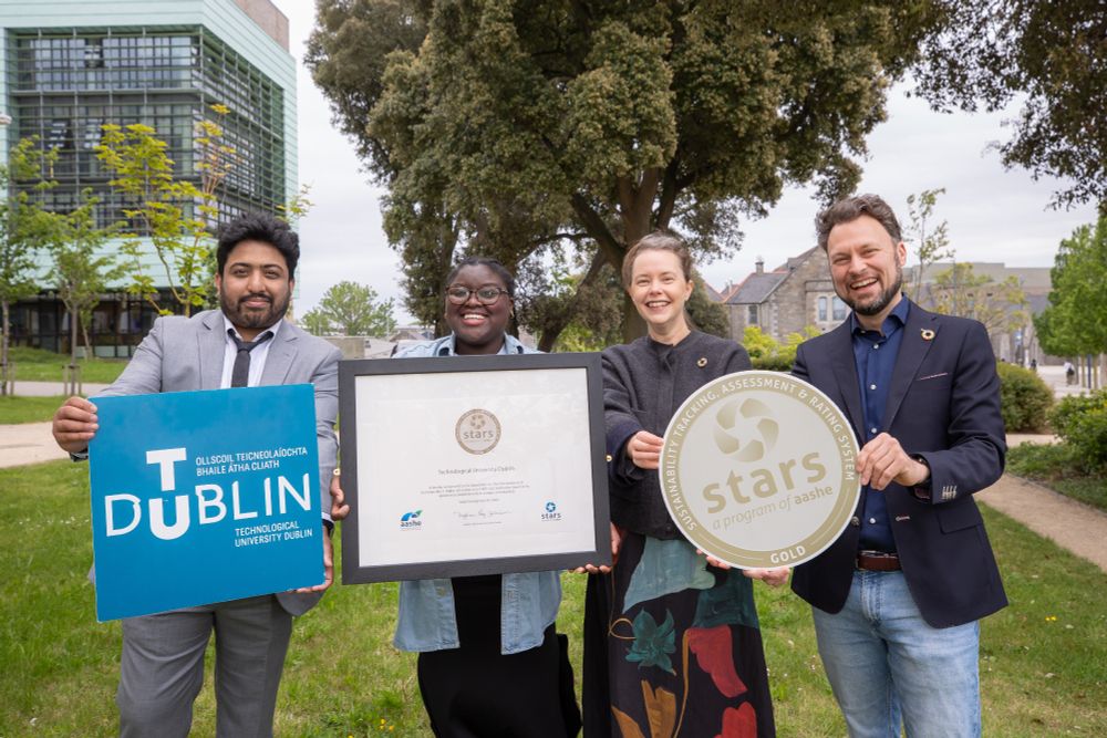 two males and two females hold certificate, TU Dublin sign and STARS sign outdoors on grangegorman campus