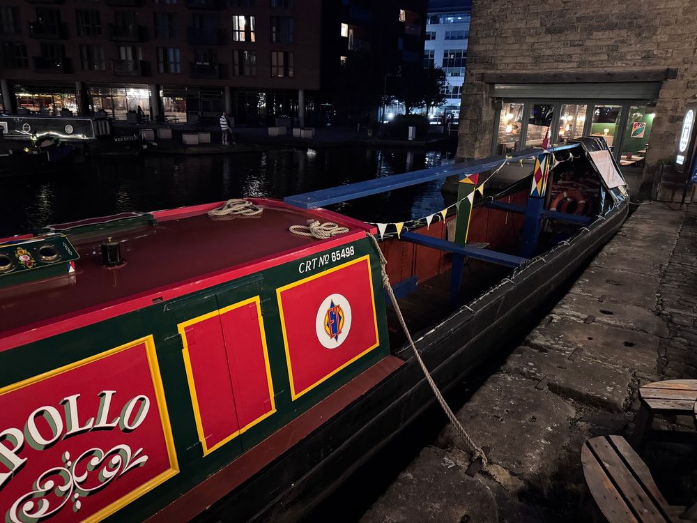 Canal boat with a section without a roof.