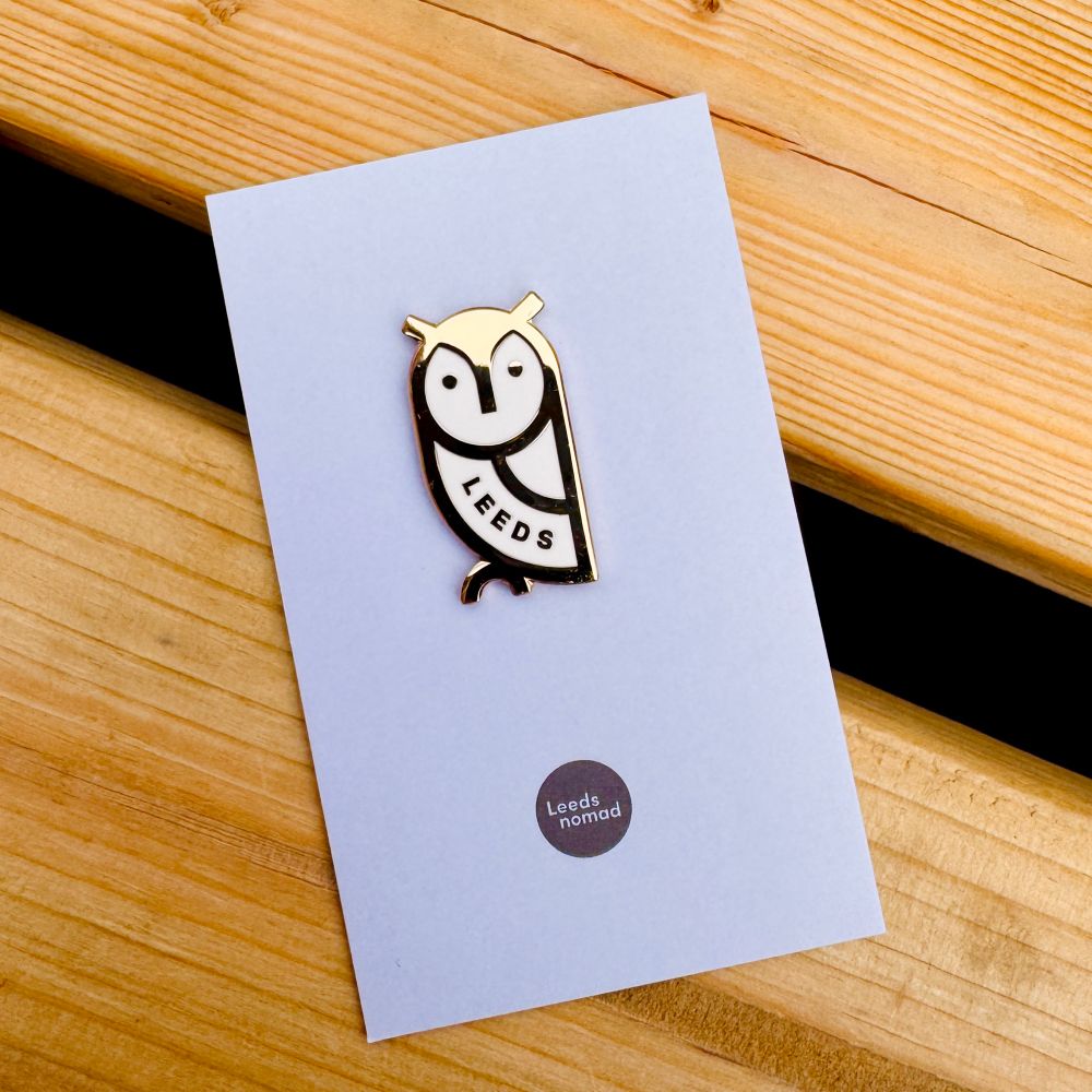 Leeds Owl badge on backing card.