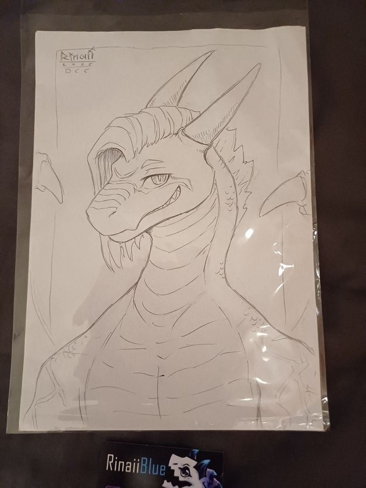 A portrait of Anax'em smiling at you with RinaiiBlue's card under it