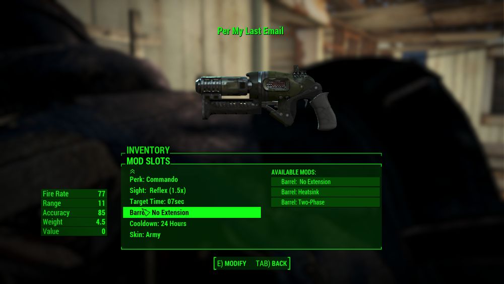 A screenshot from Fallout 4 showing a weapon being customized at a workbench. It is a futuristic-looking pistol painted in army colors that looks a bit banged up. The weapon is named "Per My Last Email".