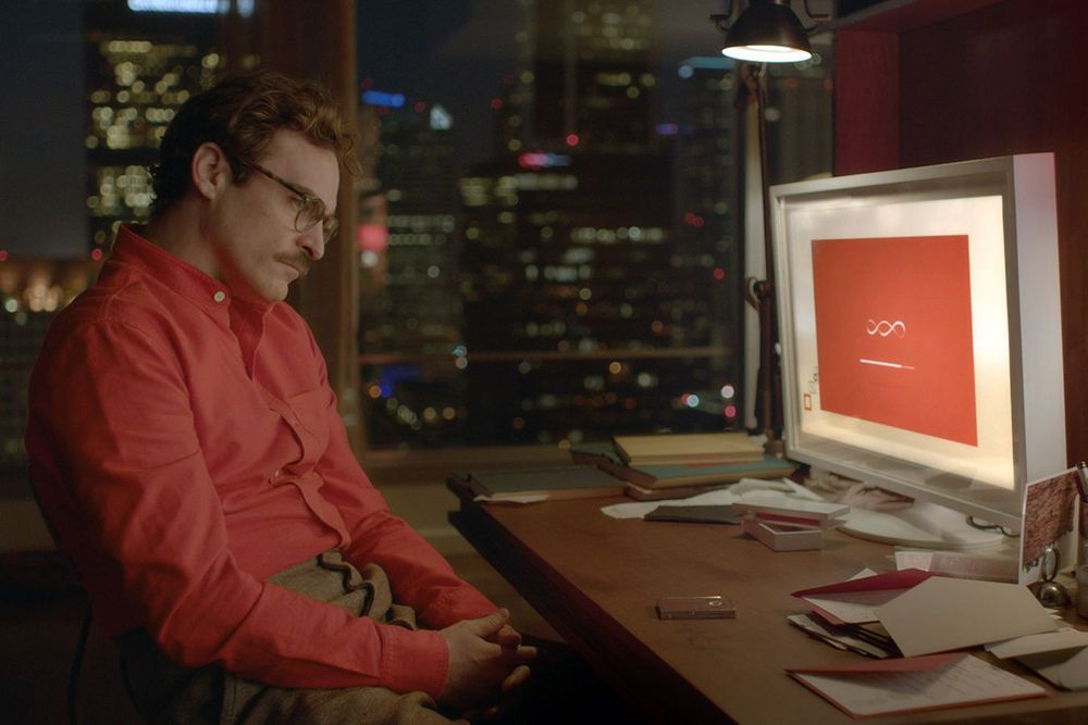 Joaquin Phoenix in Her, in front of the computer with unfriendly face