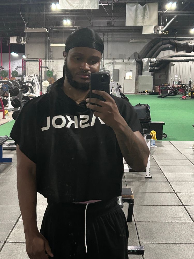 Wearing the black RASKOL hood wing and black retro joggers 